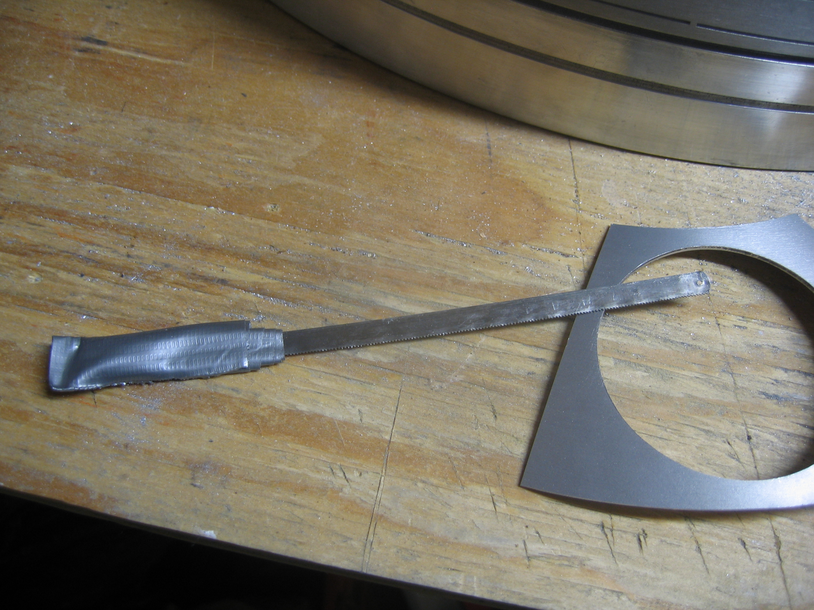 I use a small/cheap mini hacksaw blade to cut the panels out. I knocked out the pins and wrapped it in duct-tape.